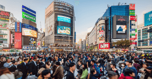 Shibuya Crossing with Yamanote Line train in the background
